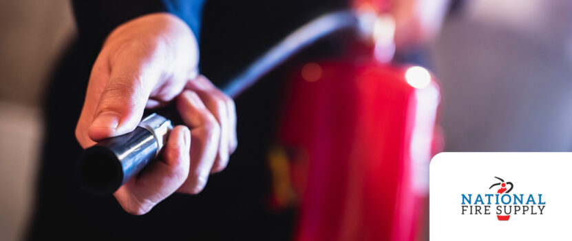 man holding fire extinguisher